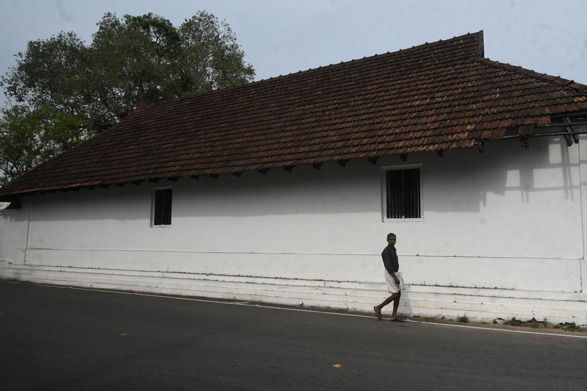 A man walks on the road outside the Mahadeva temple complex at Vaikom in Kottayam district on Wednesday.  The struggle to earn the right for people of all castes to walk on the streets around the temple, called the Vaikom Satyagraha, is celebrating its centenary in 2023. 