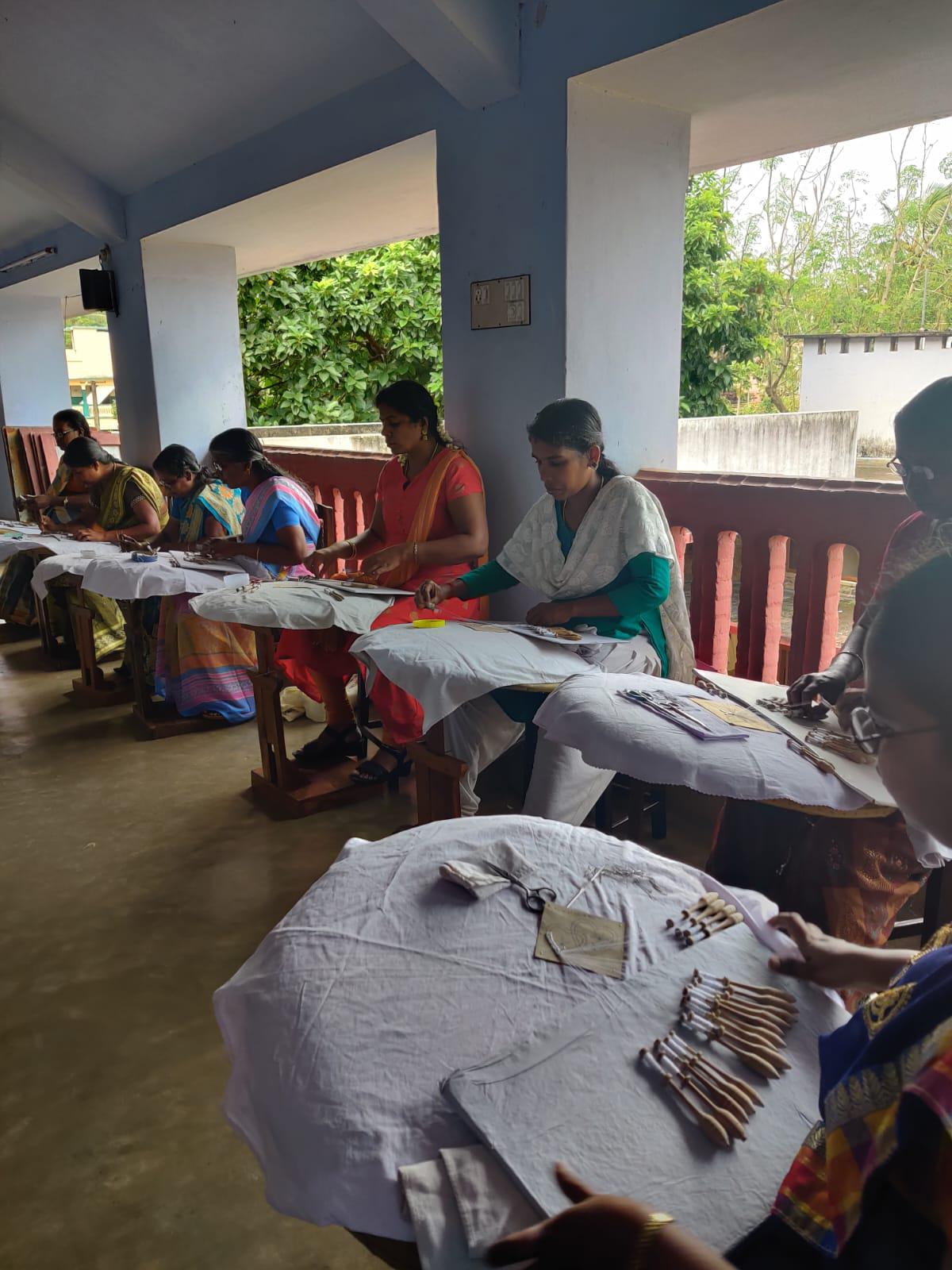 Women making Bruges Lace at the Infant Jesus Technical and Educational Institution in Mulagumoodu, Nagercoil.