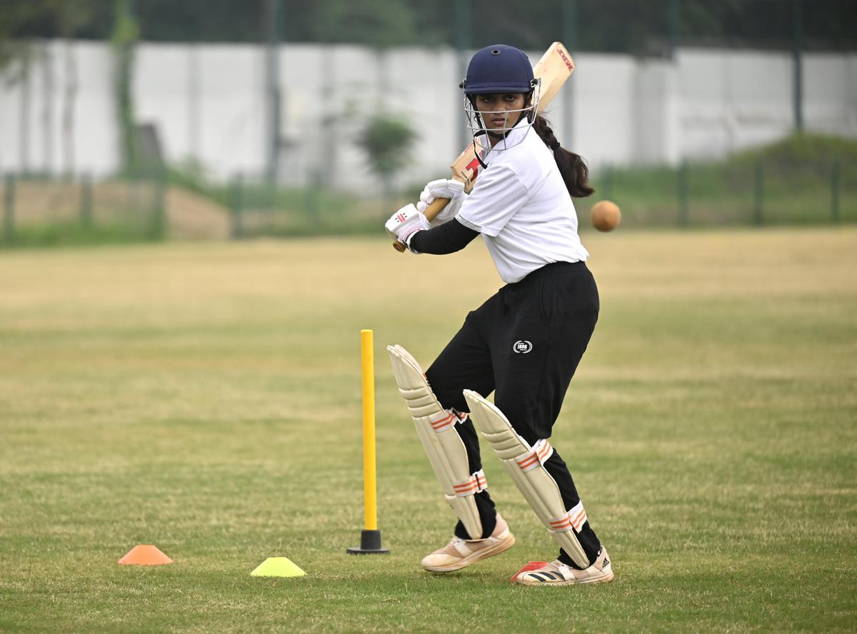 A woman practicing cricket at AM Jain college ground in Chennai.