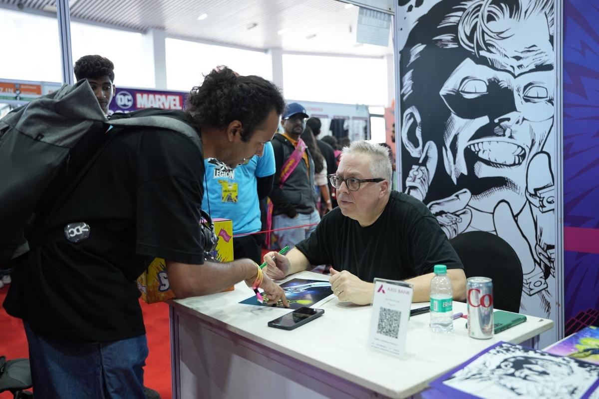 American comic book writer Ron Marz interacting with a fan.