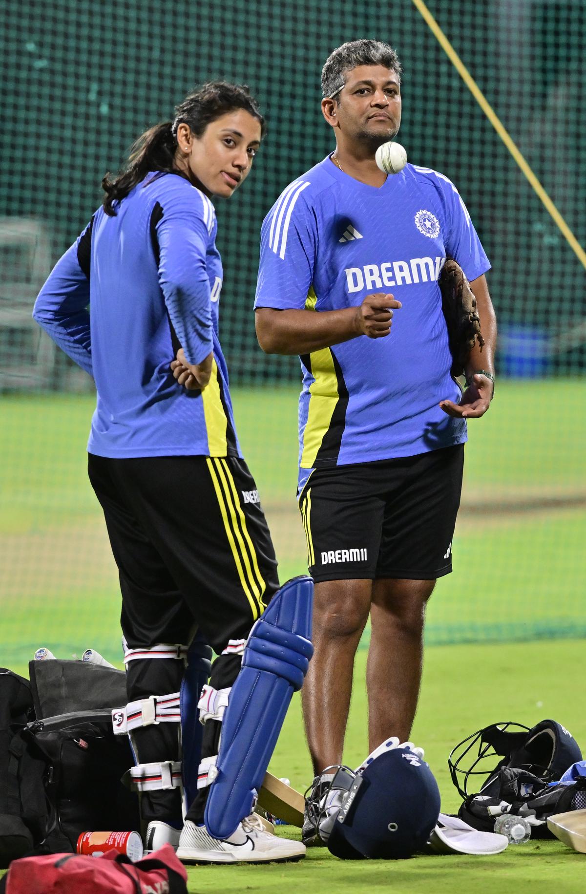 Amol Muzumdar, head coach of the India women’s national cricket team, and Smriti Mandhana, during a training session ahead of the match against South Africa, at the M Chinnaswamy stadium (KSCA), in Bengluru on June 14, 2024.