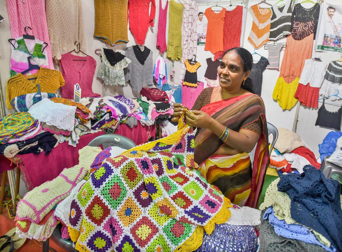 A craftswomen showing her creations at the stall of Narsapur lace at DWCRA Bazaar at AU Engineering Grounds in Visakhapatnam