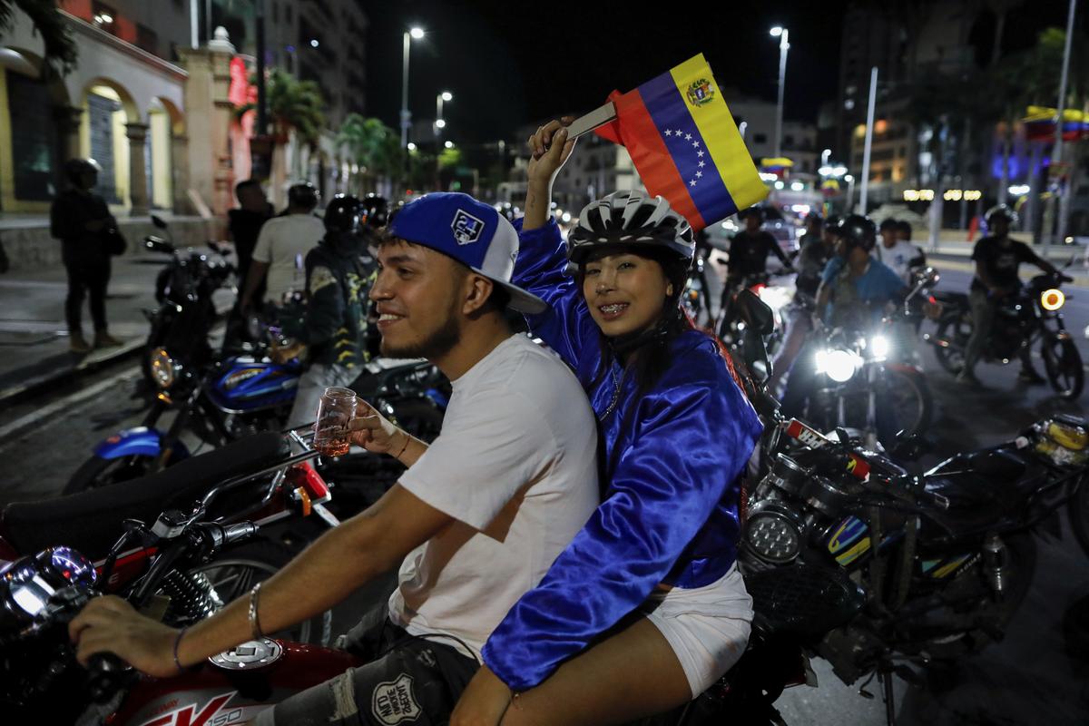 Supporters of President Nicolas Maduro celebrate after electoral authorities declared him the winner of the presidential election in Caracas, Venezuela, July 29, 2024. 