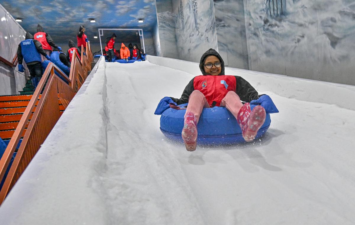 People enjoying at the newly-opened Snow Station’, a snow-themed amusement park at Viswanadha Sports Club (VSC), at Port stadium, Akkayyapalem in Visakhapatnam. 