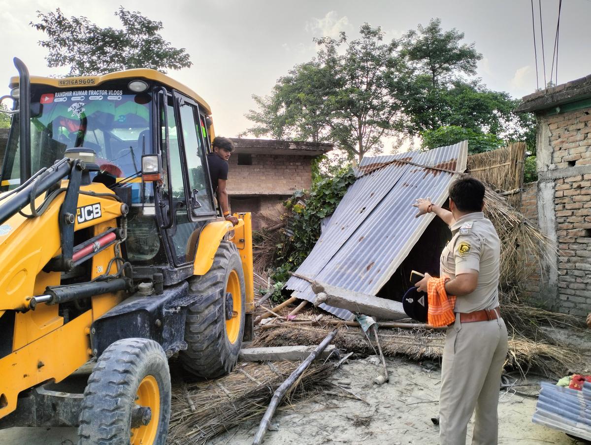 The accused's house was partially demolished using a JCB machine.