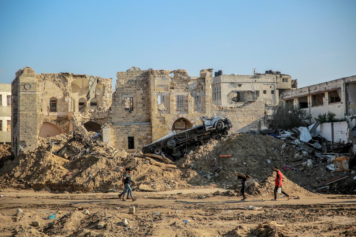 People walk in front of Gaza City’s 17th-century Qasr al-Basha, or the Pasha’s Palace, on January 5, 2024. Also known as the Radwan dynasty castle, it houses a museum and a girls’ school, which is damaged in Israeli bombardment. People walk in front of Gaza City’s 17th-century Qasr al-Basha, or the Pasha’s Palace, on January 5, 2024. Also known as the Radwan dynasty castle, it houses a museum and a girls’ school, which is damaged in Israeli bombardment.