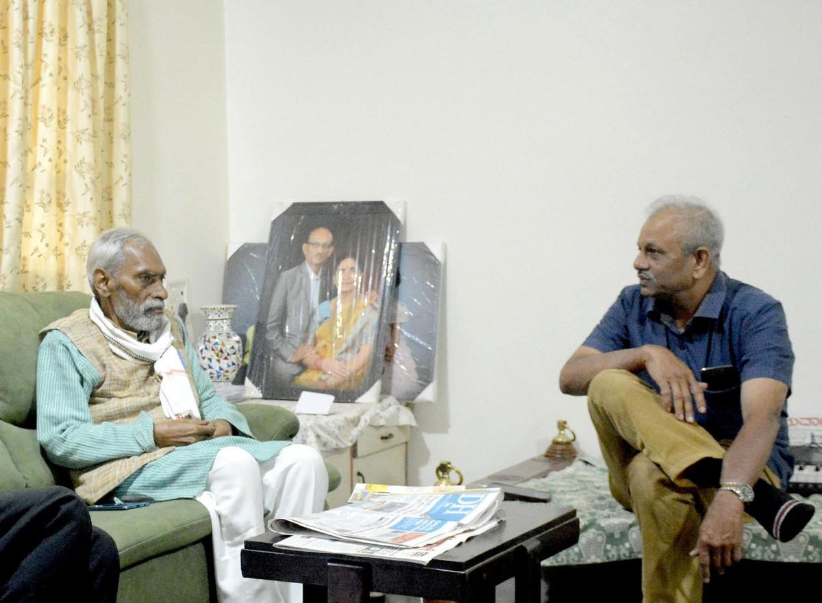 Subhash Palekar, ZBNF campaigner, speaks to Vilas Adhyapak, Marathi writer in Belagavi during a recent visit. 