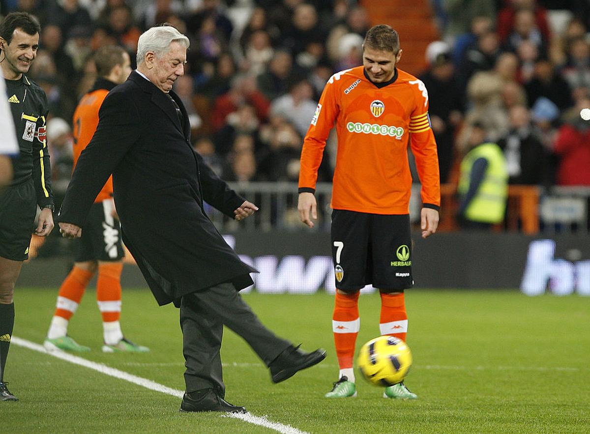 Writer Mario Vargas Llosa kicks off the La Liga match between Real Madrid and Valencia in Madrid, December 2010.