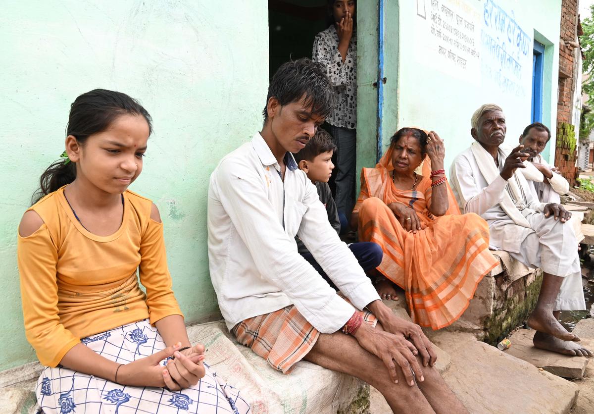 The family members of Ashutosh Prajapati, 11, and (right) Nitish Patel, 10, who died in the wall collapse at Shahpur during a religious event.