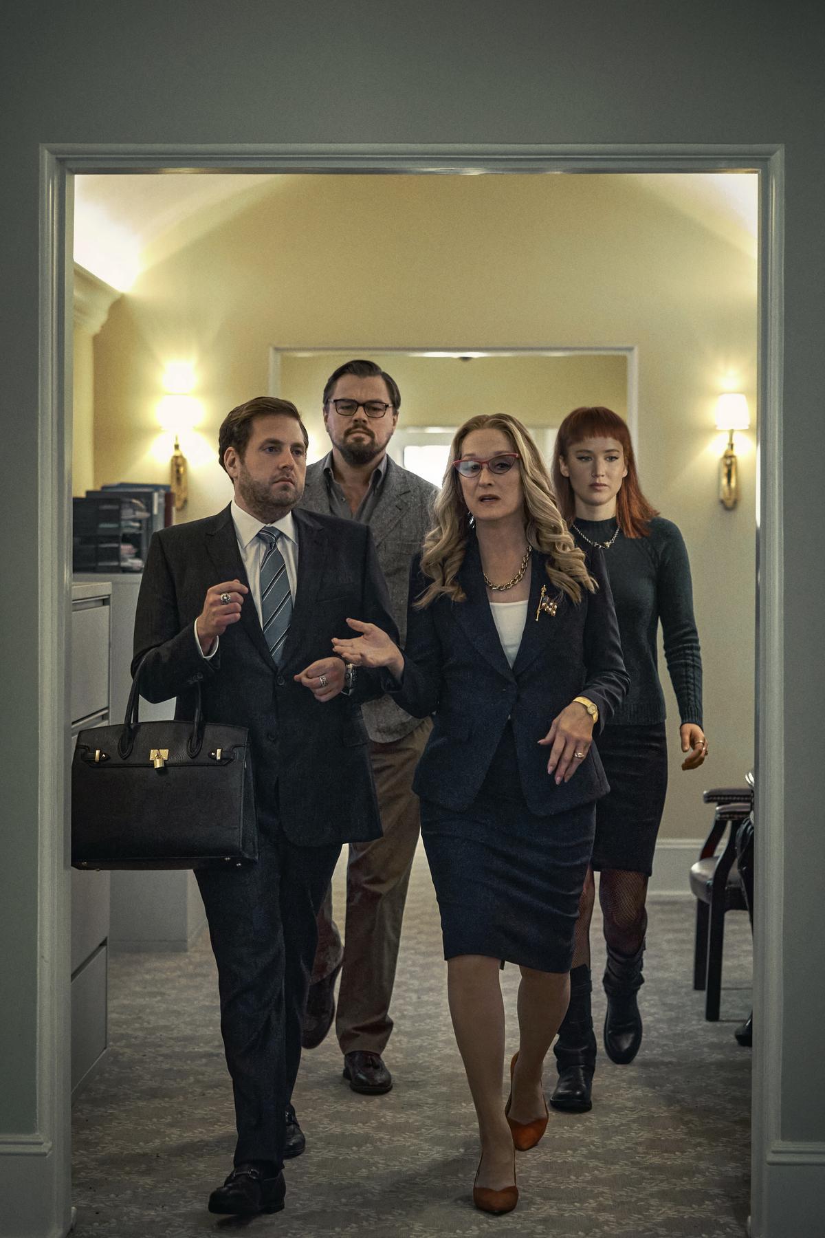 This image released by Netflix shows Jonah Hill as Jason Orlean, Leonardo DiCaprio as Dr. Randall Mindy, Meryl Streep as President Janie Orlean and Jennifer Lawrence as Kate Dibiasky in a scene from “Don’t Look Up.”