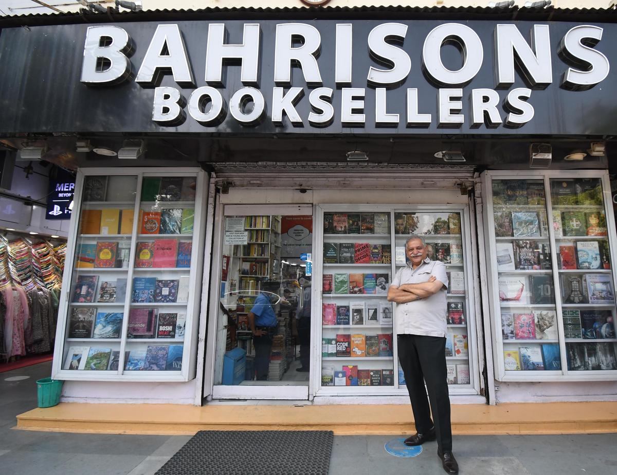 Anuj Bahri Malhotra, owner of Bahrisons Book Store, pose for a picture outside his store in Khan Market