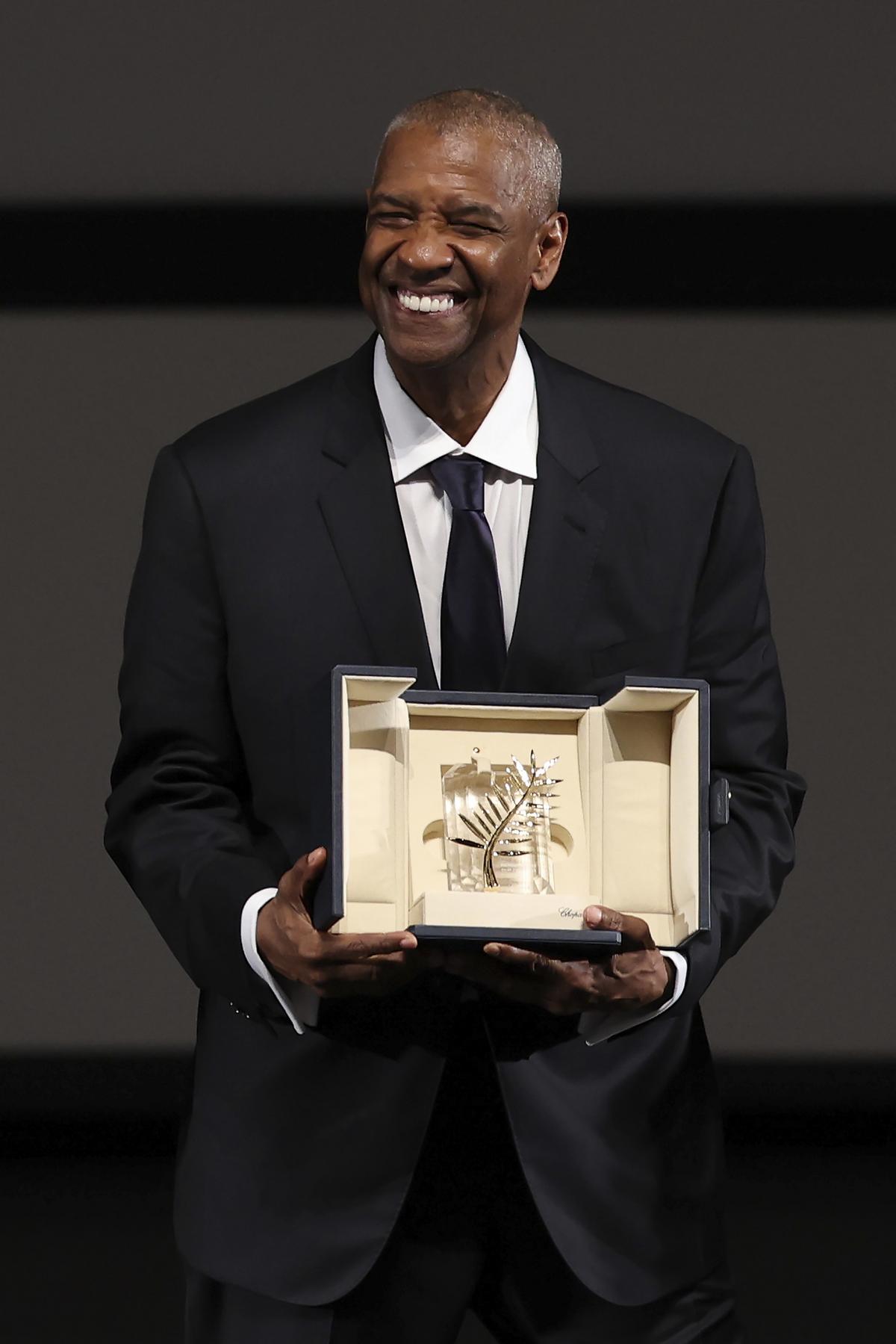 Danzel smiles after receiving the Pale D'Or, which is ahead of the 'Hest 2 lowest' screening in the 78th edition of the Washington Cannes Film Festival Danzel smiles after receiving the Pale D'Or, which is ahead of the 'Hest 2 lowest' screening in the 78th edition of the Washington Cannes Film Festival