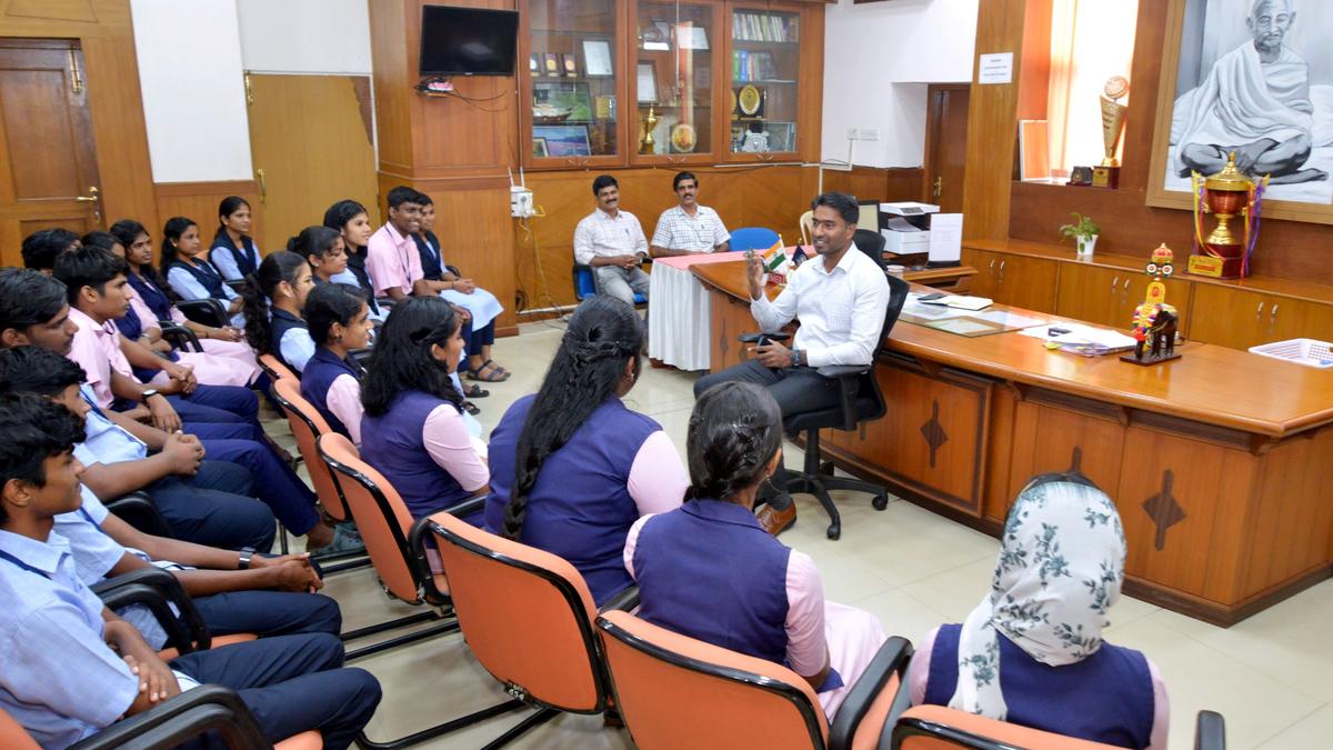 Students interact with District Collector