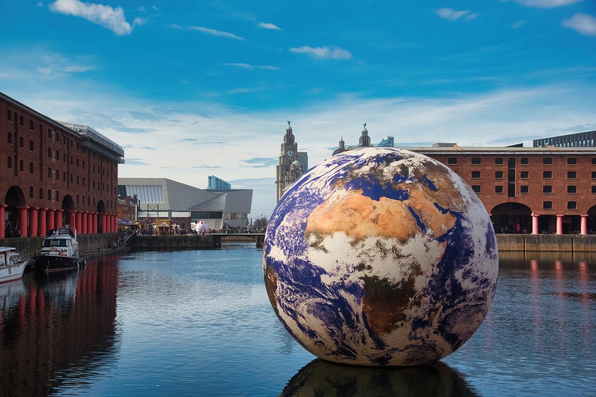 A giant 10-metre-wide art installation called ‘Floating Earth’ by artist Luke Jerram at the Royal Albert Dock in Liverpool, U.K., April 2023.