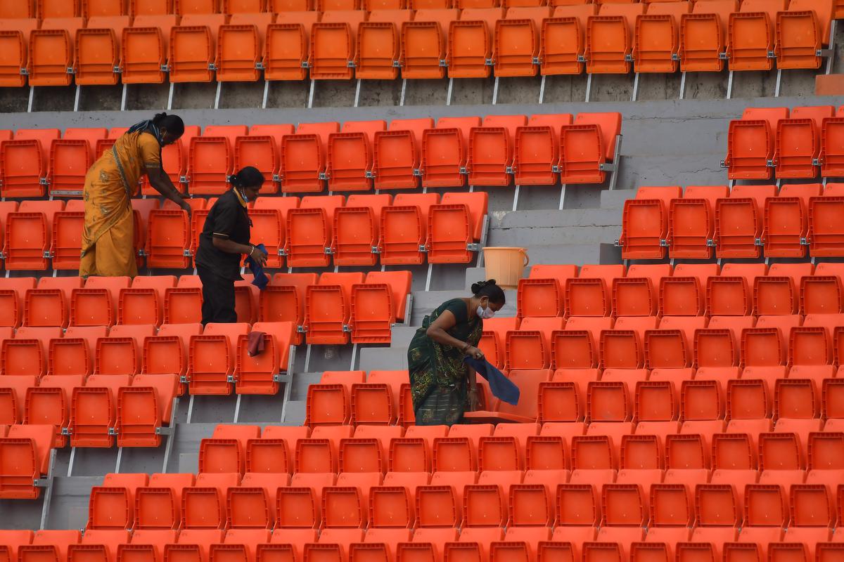 Maintenance staff cleaning the stands at Rajiv Gandhi International Stadium in Hyderabad on the eve of the Test match against England.  