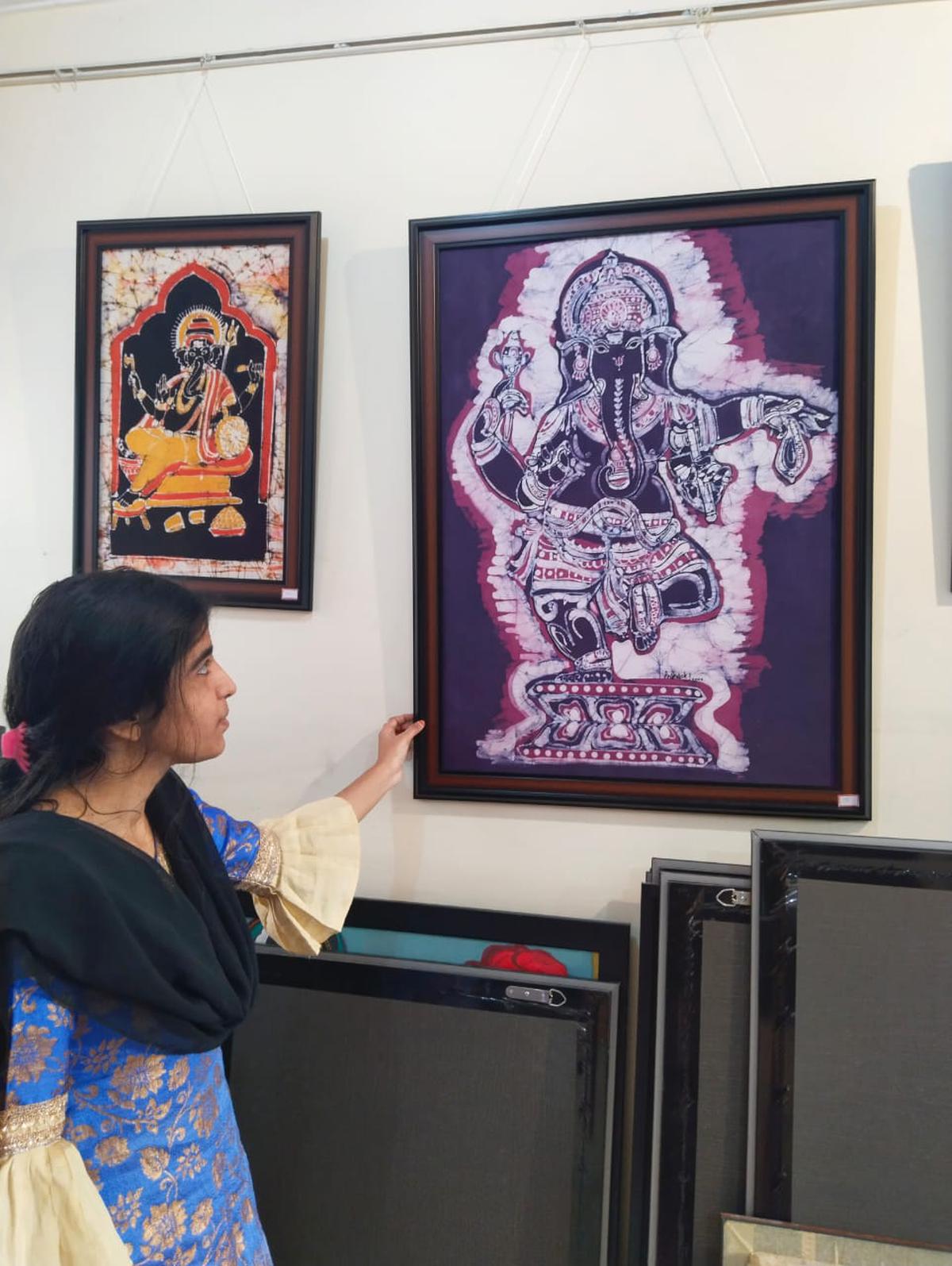 Visitor looks at a Ganesha work at the gallery