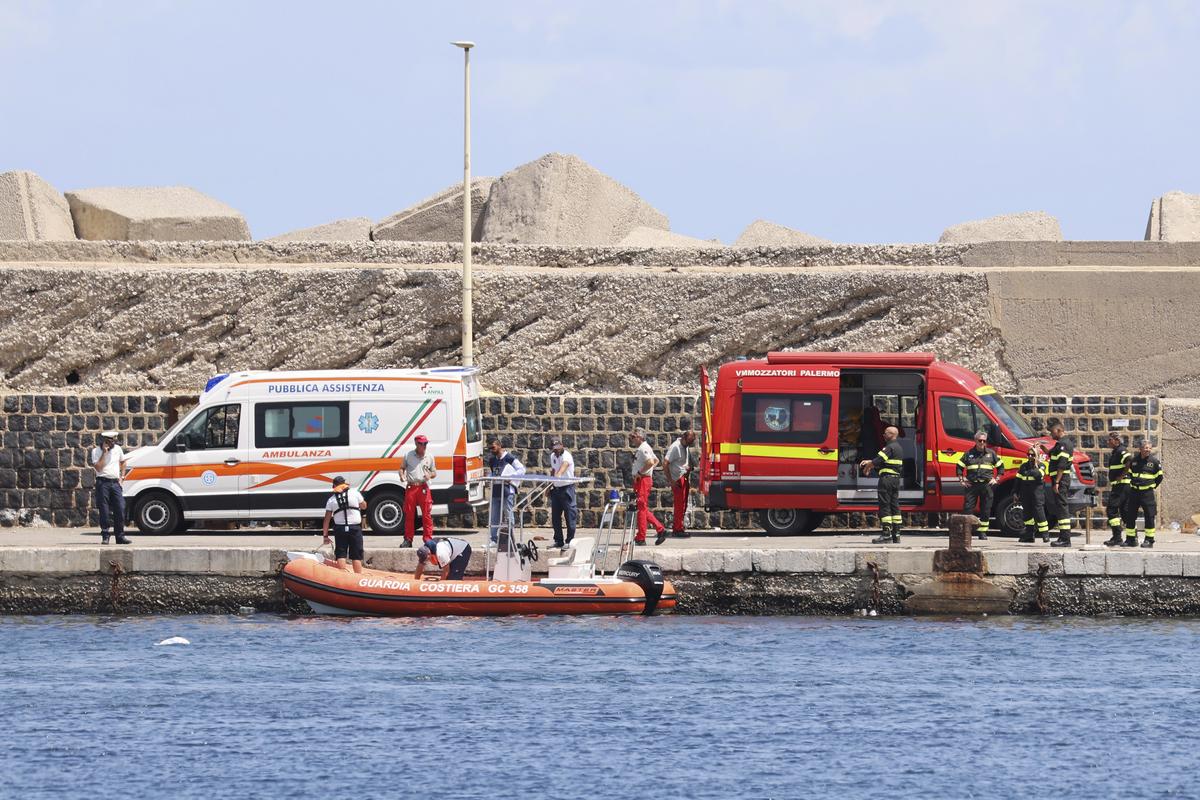 Emergency services at the scene of the search for a missing boat, in Porticello Santa Flavia, Italy.