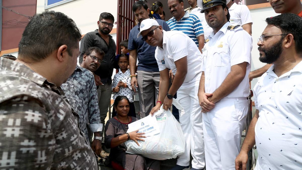 Customs, Central GST officials distribute relief material to flood victims in Vijayawada