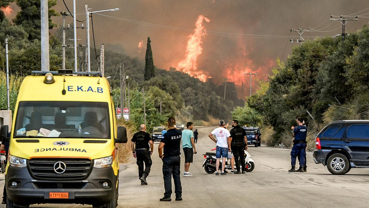 At least three dead, thousands displaced as wildfires rage across southern Europe