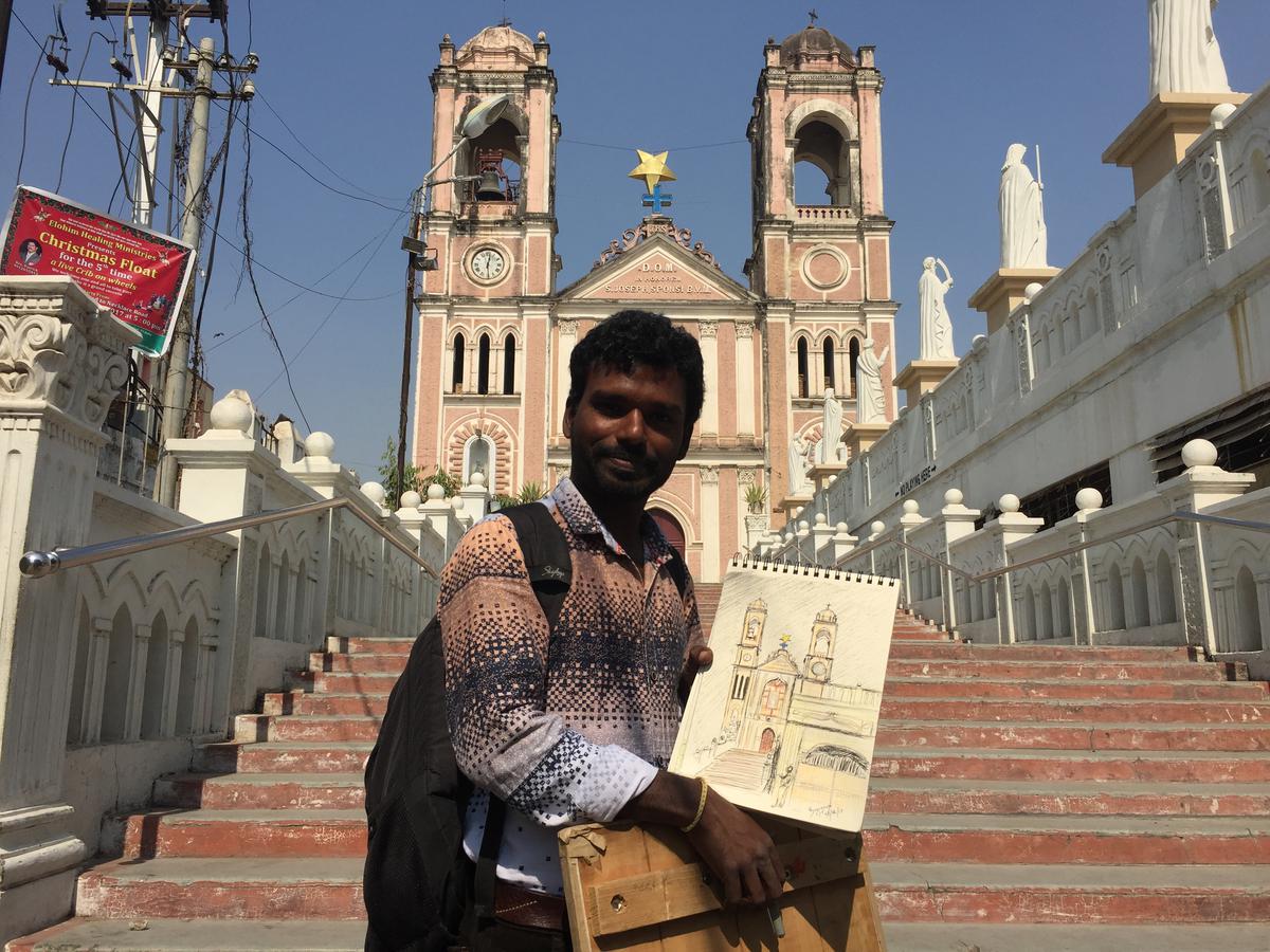 An artist displays his sketch of St. Joseph’s Cathedral in Gunfoundry An artist displays his sketch of St. Joseph’s Cathedral in Gunfoundry