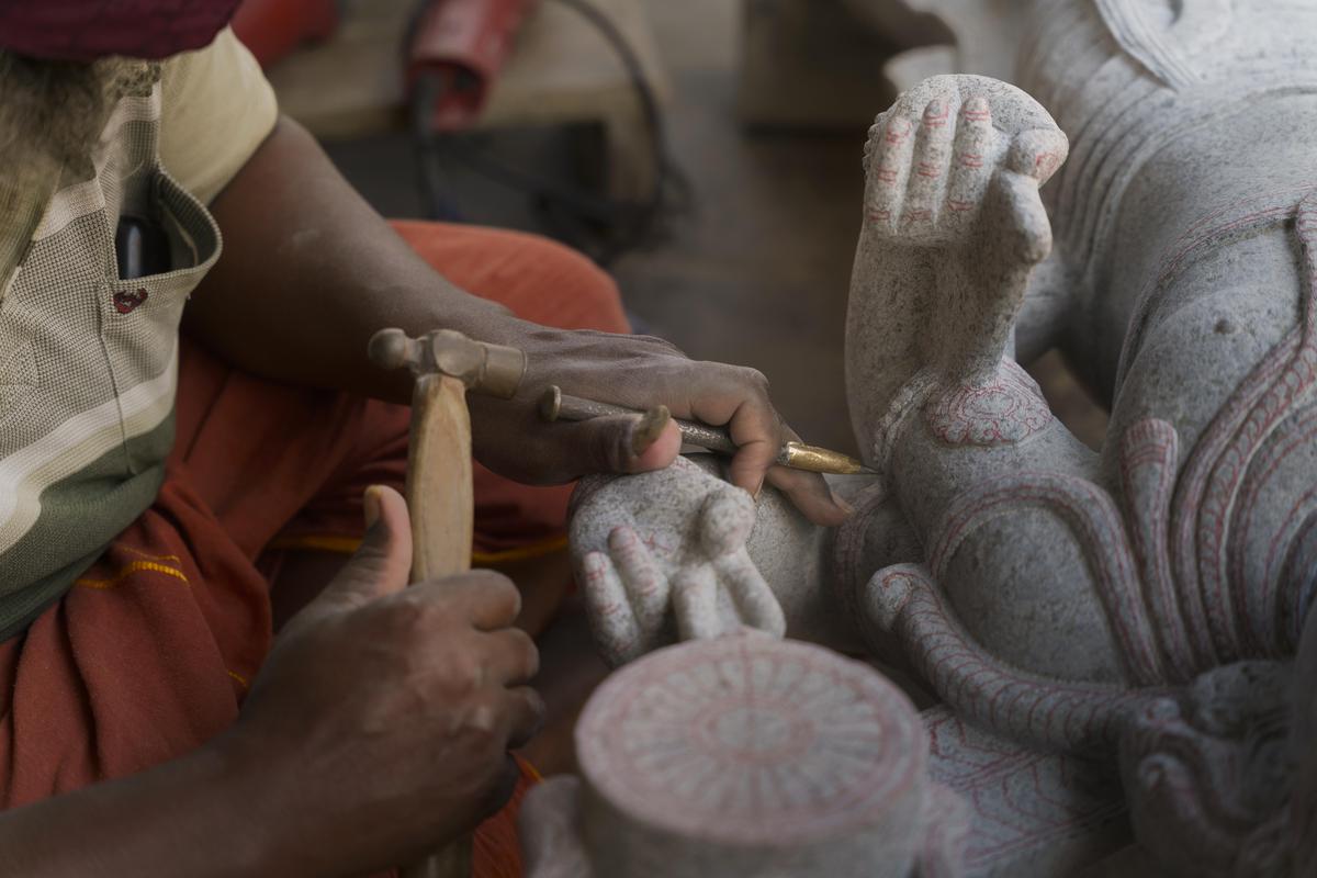 A sculptor at work in Mamallapuram