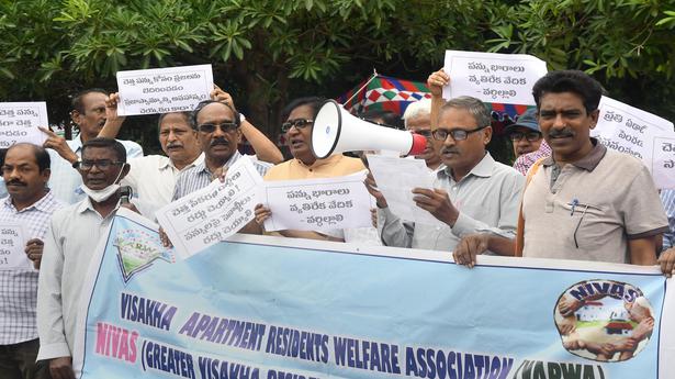 VARWA and NIVAS stage a protest seeking scrapping of user charges for garbage collection in Visakhapatnam