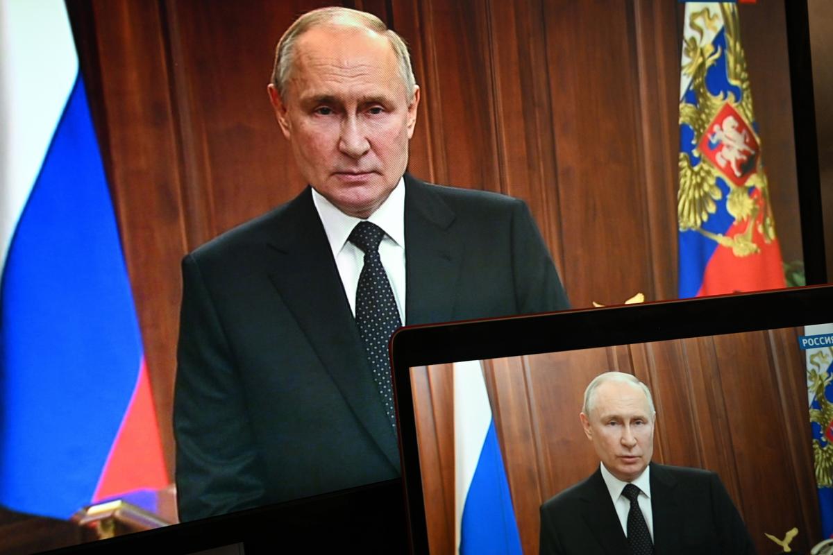 Russian President Vladimir Putin is seen on monitors as he addresses the nation after Yevgeny Prigozhin, the owner of the Wagner Group military company, called for armed rebellion and reached the southern city of Rostov-on-Don with his troops, in Moscow, Russia, on June 24, 2023. 