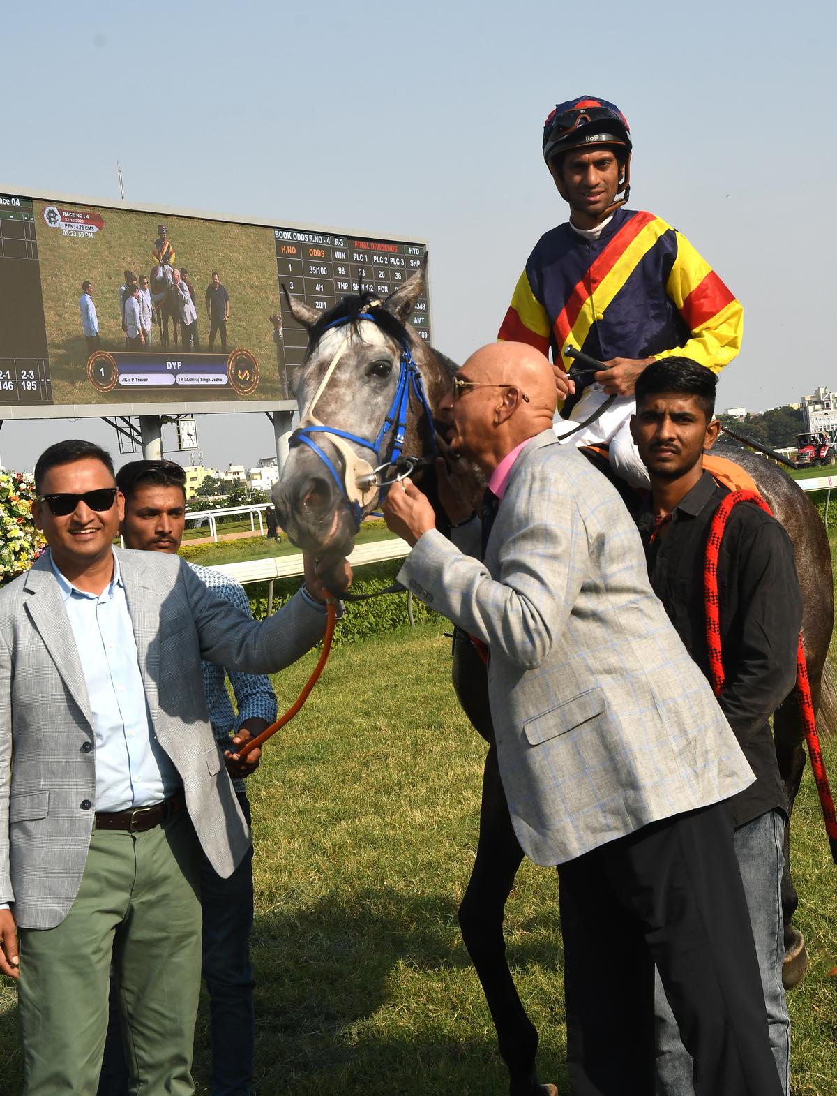 Owners Rama Seshu Eyunni, right, Rishikesh Bhosale, left, and Jockey P Trevor, who rode DYF to victory in the HRC The Golconda St. Leger (Grade II)  in Hyderabad on Sunday, October 22, 2023.