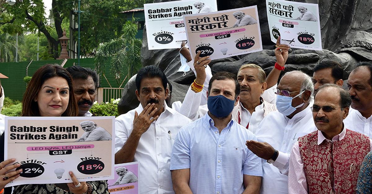 Congress Leader Rahul Gandhi along with Opposition Party MPs staged a protest demonstration against the GST in essential commodities in front of the Gandhi Statue during the Monsoon Session at Parliament House in New Delhi on Tuesday, July 19, 2022. 