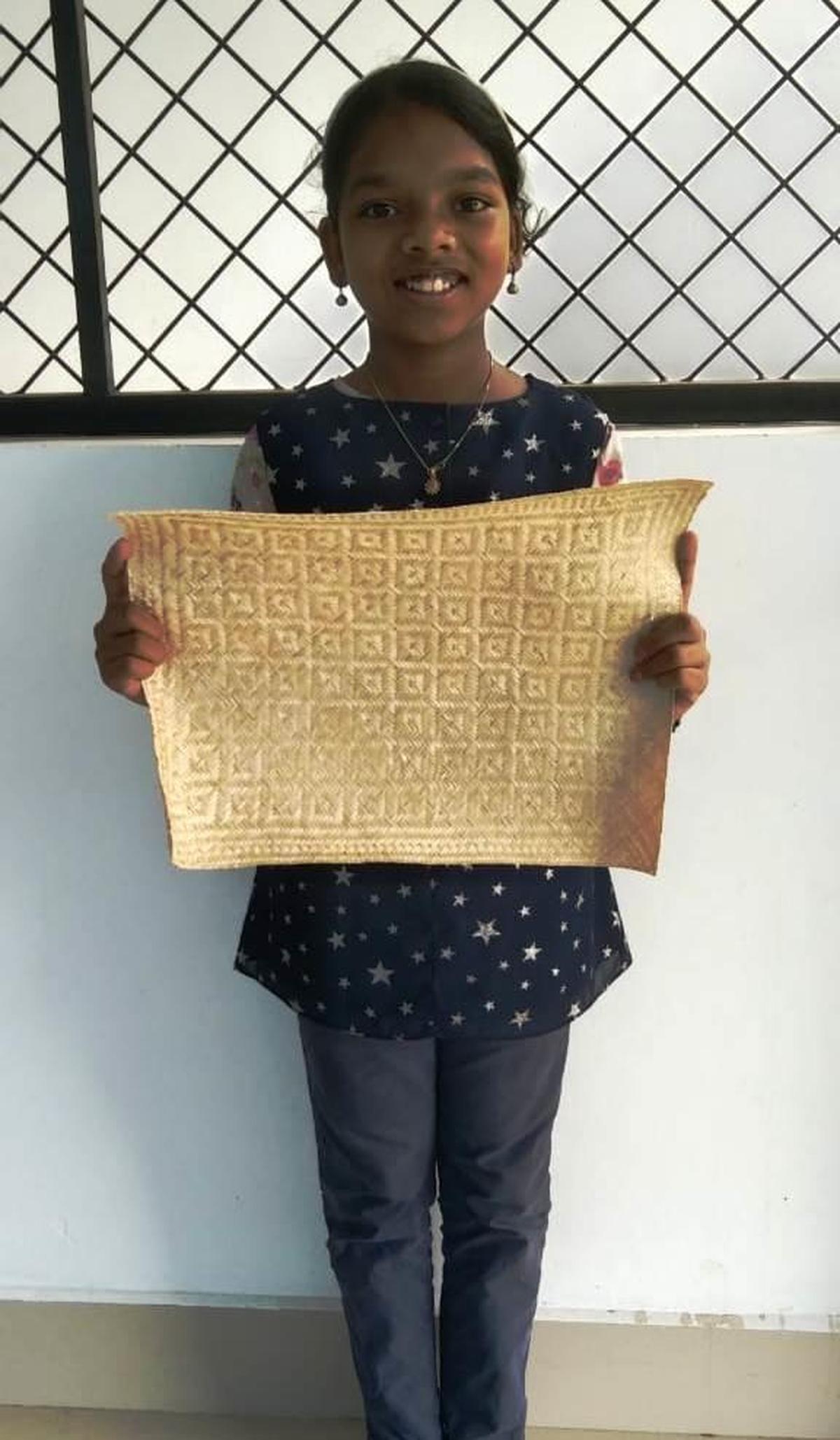 Aditya Anish, a Class V student wove a Kannadippaya — a traditional tribal mat — earning the first grade in the sub-district science festival held recently at Arakkulam.