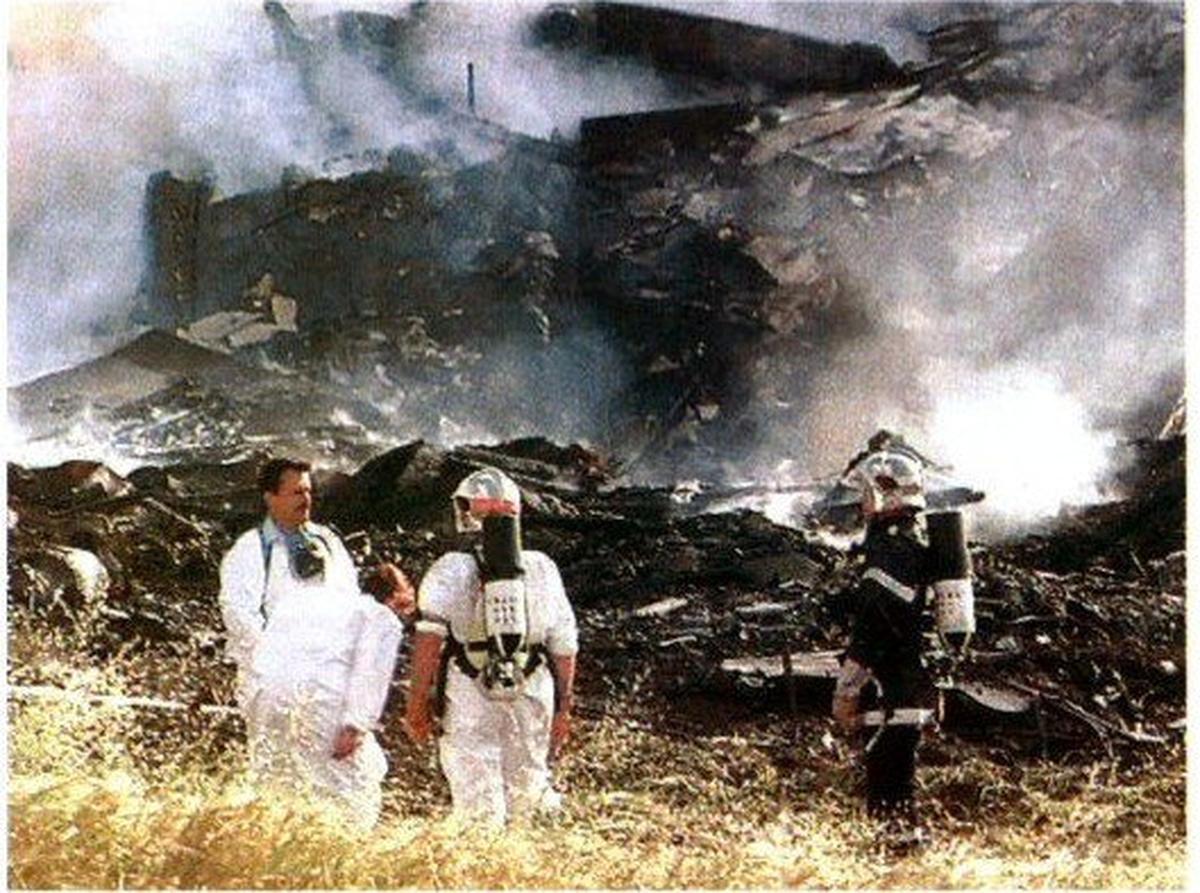 Rescue workers stand near the debris of the hotel on which an Air France Concorde crashed in Gonesse, outside Paris, shortly after takeoff Rescue workers stand near the debris of the hotel on which an Air France Concorde crashed in Gonesse, outside Paris, shortly after takeoff