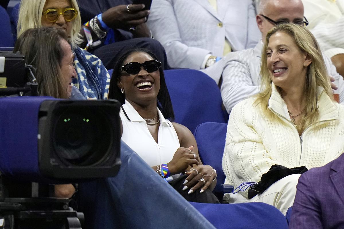 Gymnast Simone Biles (centre), reacts after Coco Gauff mentioned her during the second round of the U.S. Open tennis championships, on August 28, 2025. Gymnast Simone Biles (centre), reacts after Coco Gauff mentioned her during the second round of the U.S. Open tennis championships, on August 28, 2025.