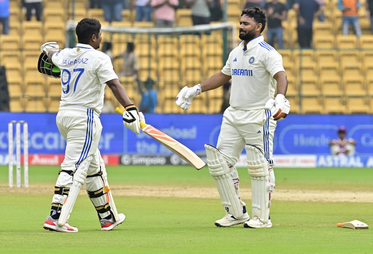 Sarfaraz Khan celebrates with Rishabh Pant.