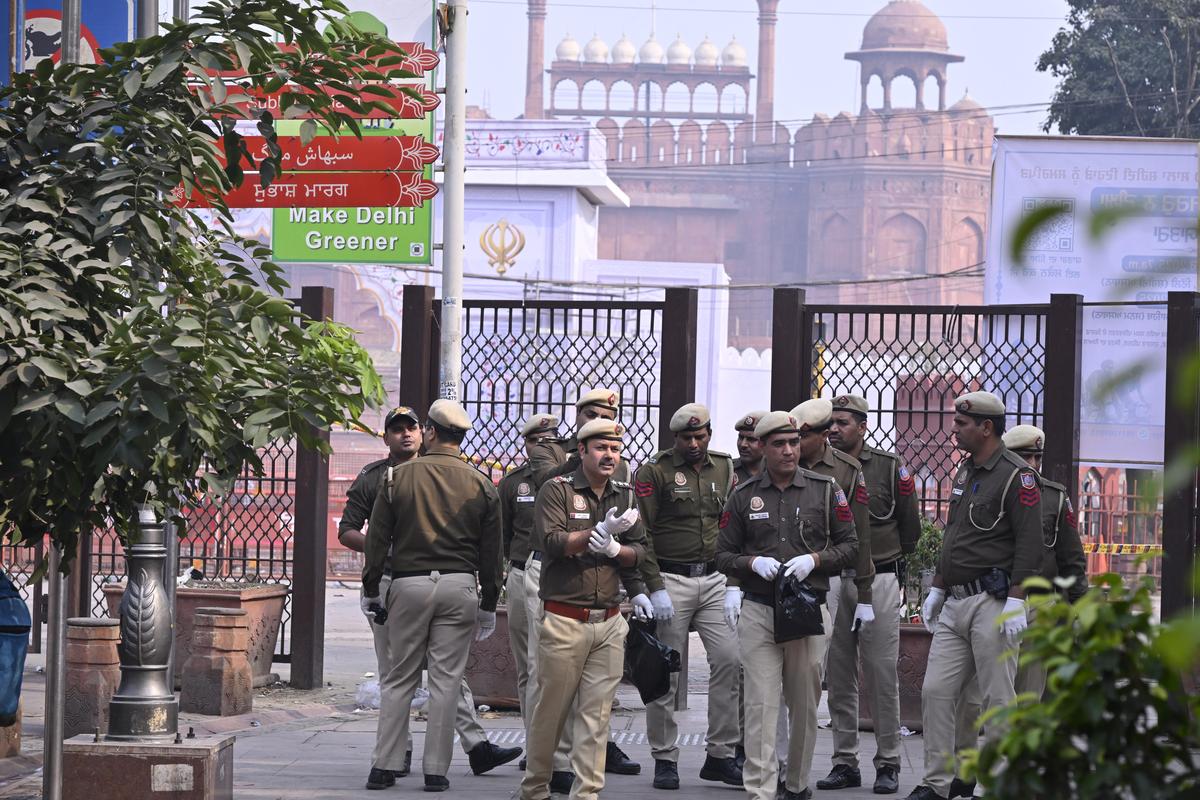 Delhi Police personnel stand guard at the blast site near the Red Fort. Delhi Police personnel stand guard at the blast site near the Red Fort.