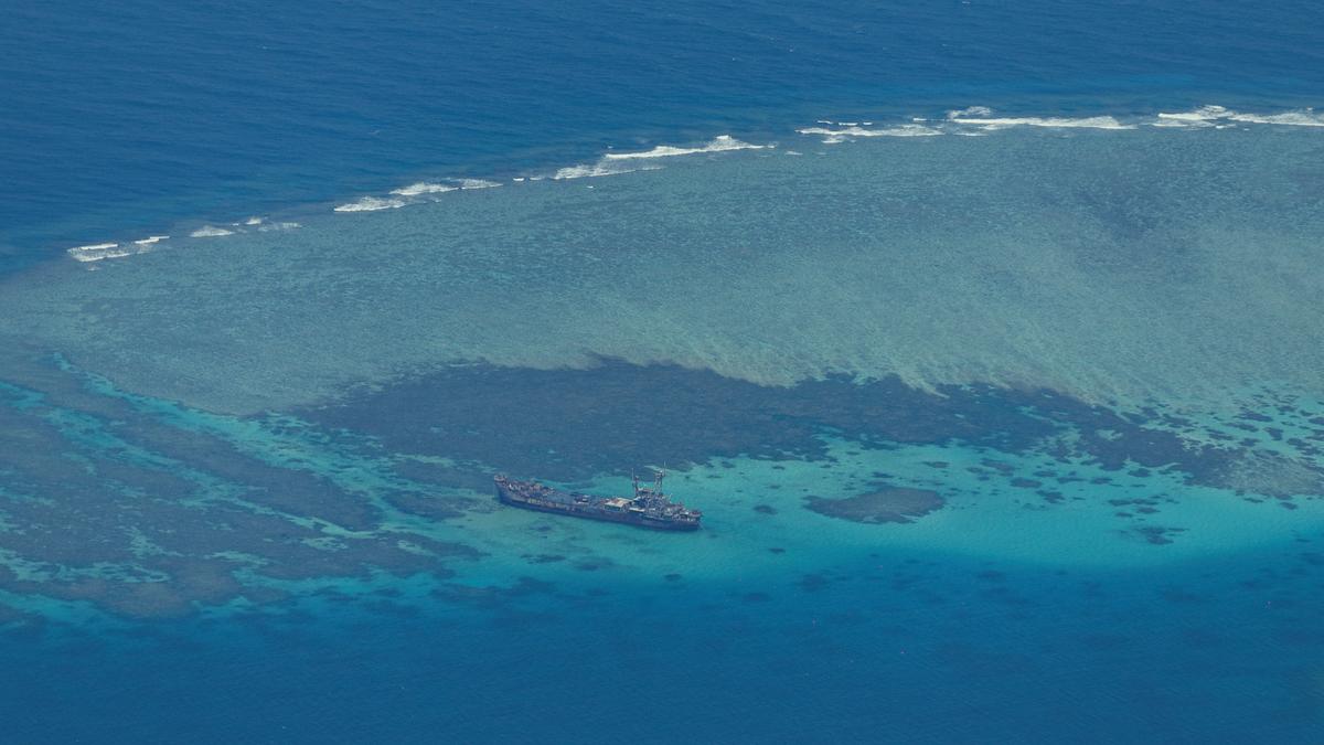China says Philippine vessel "illegally" landed on disputed atoll