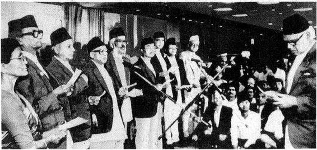The Nepalese Prime Minister, Mr. Krishna Prasad Bhattarai (extreme right) administering the oath of office to his Cabinet in Kathmandu on Thursday. A pro-democracy campaign launched by his Nepali Congress party in collaboration with the United Left Front put an end to the partyless panchayat system. The Cabinet has four men from the Nepali Congress and among others, three from the United Left Front led by Mrs. Sahana Pradhan (extreme left), the lone woman in the Government. The Nepalese Prime Minister, Mr. Krishna Prasad Bhattarai (extreme right) administering the oath of office to his Cabinet in Kathmandu on Thursday. A pro-democracy campaign launched by his Nepali Congress party in collaboration with the United Left Front put an end to the partyless panchayat system. The Cabinet has four men from the Nepali Congress and among others, three from the United Left Front led by Mrs. Sahana Pradhan (extreme left), the lone woman in the Government.