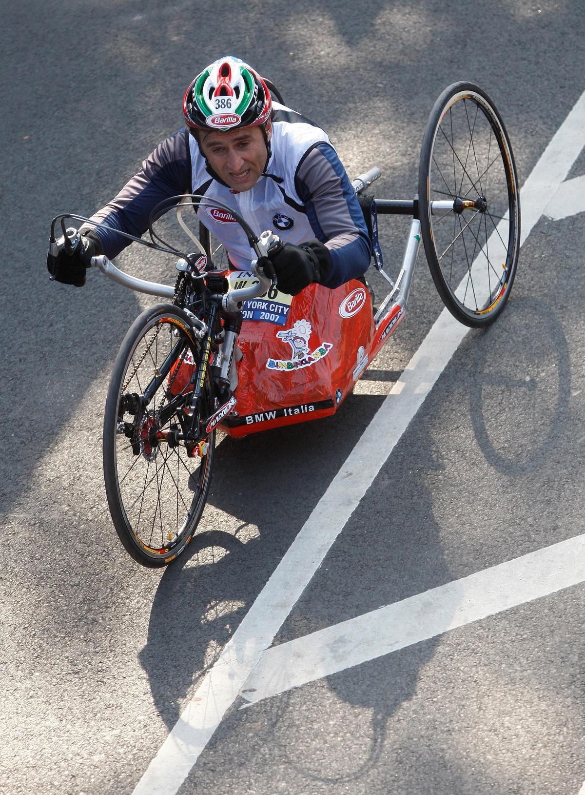 Italian Race car driver Alex Zanardi crosses the finish line in the Handcycle Division during the 2007 ING New York City Marathon in New York, on November 4, 2007
