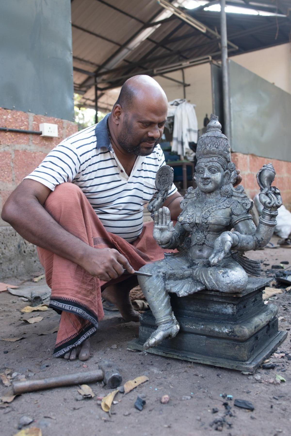 Valsan Kunhimangalam with the incomplete idol of Durga Devi