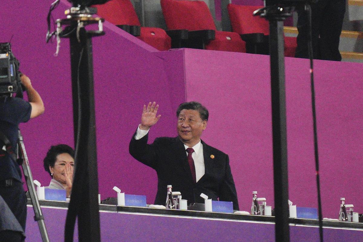 Chinese President Xi Jinping waves during the opening ceremony of the 19th Asian Games in Hangzhou, China on September 23, 2023. 