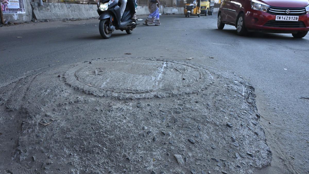 A dangerously elevated manhole in&nbsp;Medavakkam