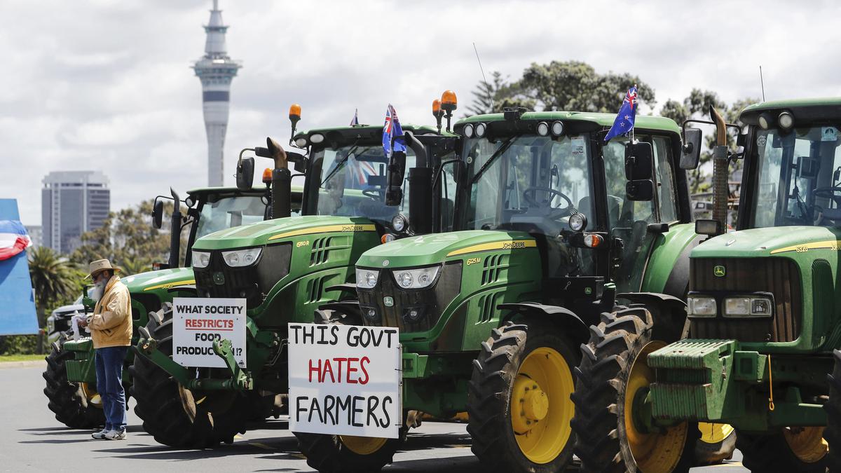 New Zealand farmers hit streets to protest cow-burp tax plan