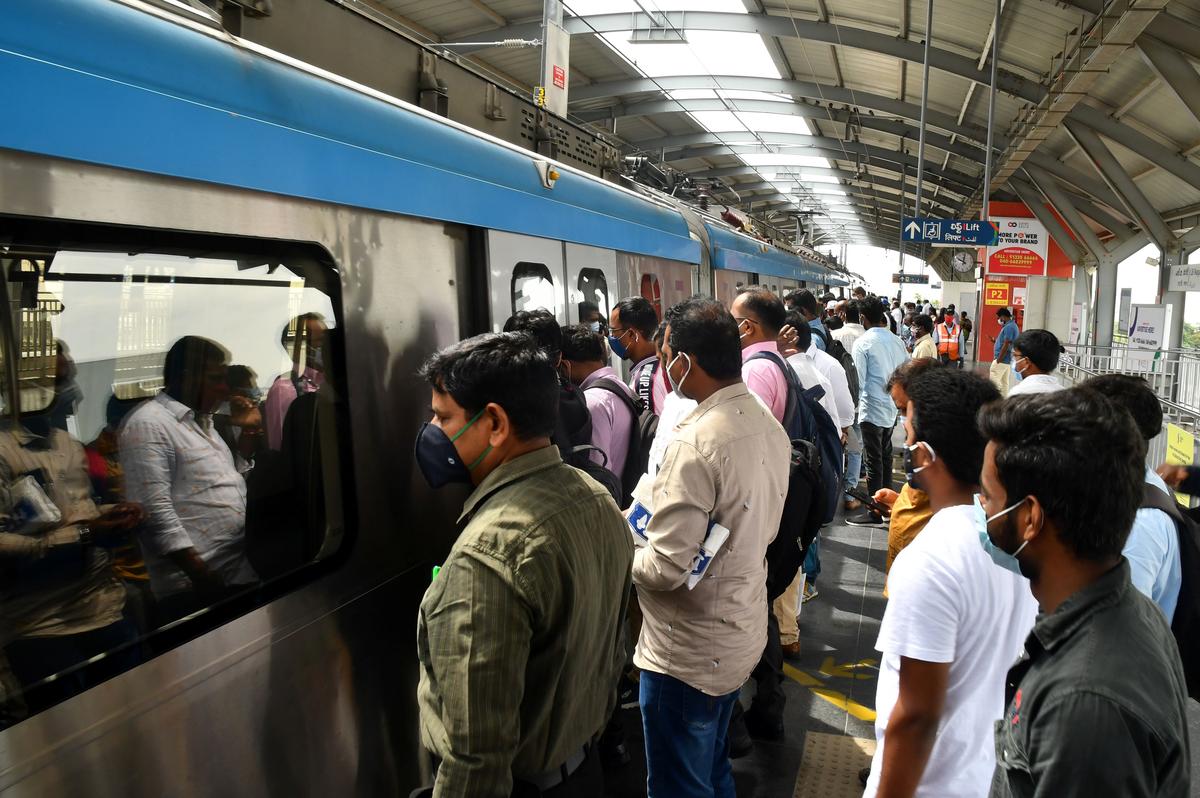 Passengers seen accessing the Hyderabad Metro Rail.