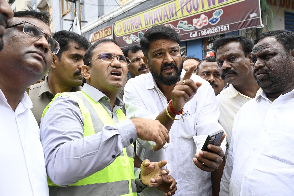 Chairman and Managing Director of the Southern Power Distribution Company of Telangana Ltd Md. Musharraf Faruqui and officials at the site after five people died from electrocution when a trailer vehicle came in contact with overhead electric wires during a procession organised as part of Janmashtami celebrations, at Ramanthapur in Hyderabad on Monday, August 18, 2025. 