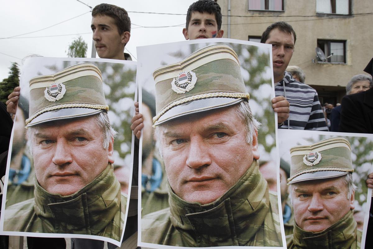 Bosnian Serb people holding photos of former Gen. Ratko Mladic during a protest in Kalinovik, Bosnia, hometown of the Bosnian Serb wartime military leader, 70 kms southeast of Sarajevo, Sunday, May 29, 2011.