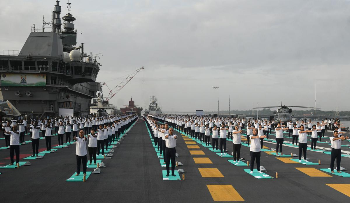 Indian armed forces and their families members perform Yoga on the deck of  the Indian Naval aircraft carrier Viraat to mark International Yoga Day in  Mumbai, India, Wednesday, June 21, 2017. Yoga