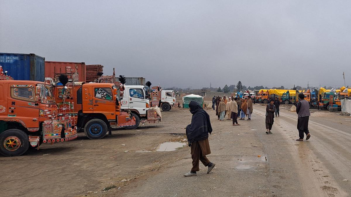 Afghan and Pakistani forces trade fire at the border as a key crossing remains closed