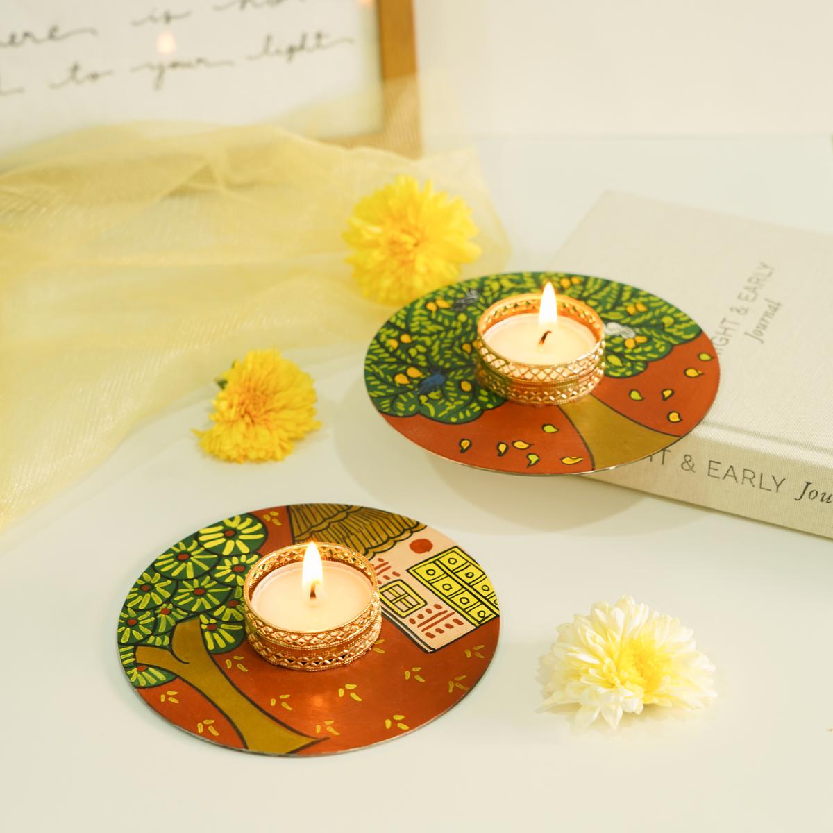 Tealight candle holder on a old music CD  that is painted with Cheriyal art 