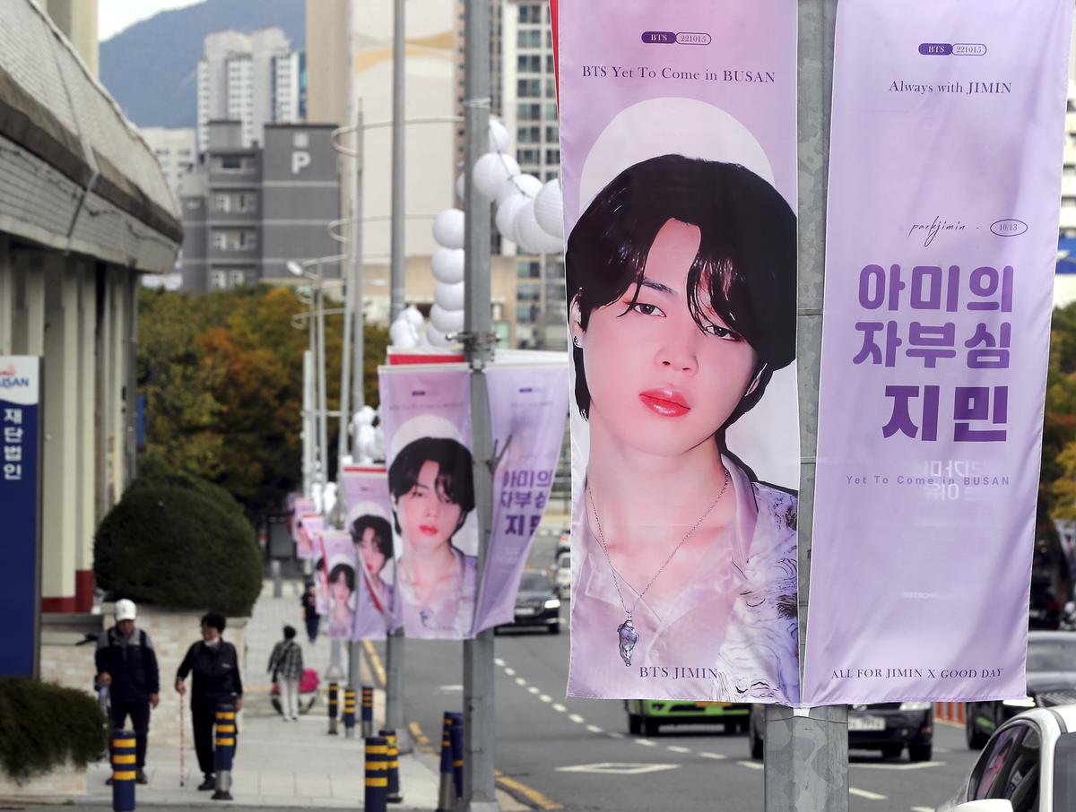 Posters of K-pop band BTS line a road in Busan where the group held a free concert on October 15, 2022.