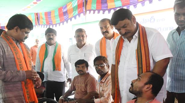 BJP leaders distribute artificial limbs, wheelchairs to physically challenged in Visakhapatnam