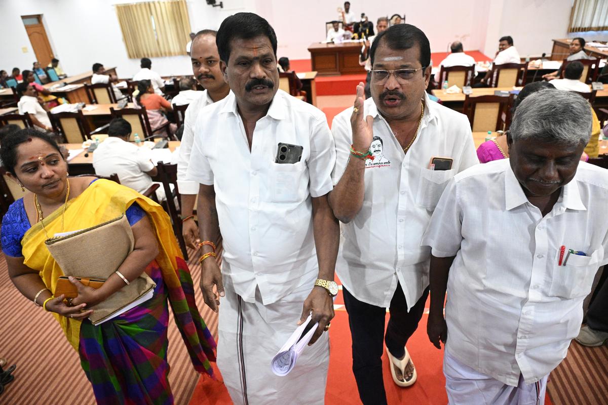 AIADMK councillors staging a walkout from the council meeting in Salem Corporation on Friday.